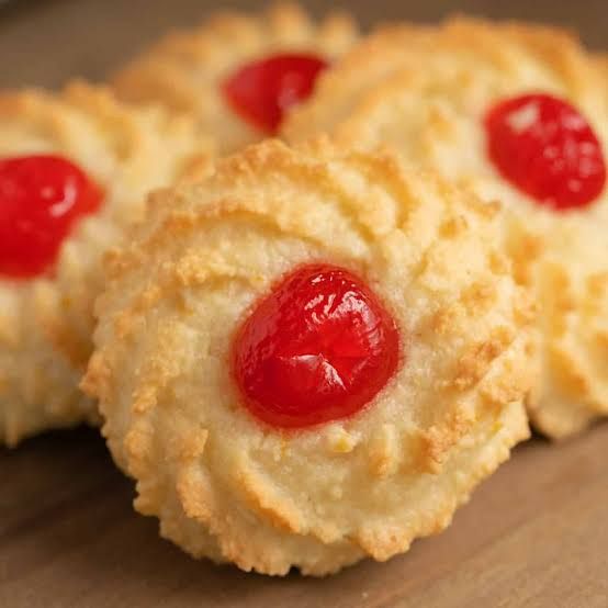 Almond cookies with a red cherry on top