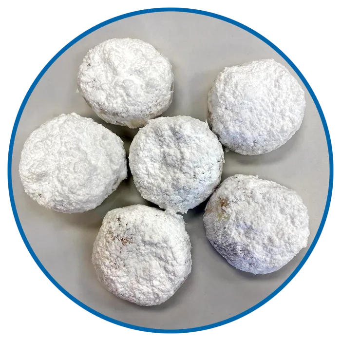 Kourambiethes dusted in powdered sugar